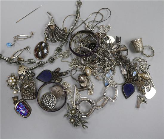 A group of assorted mainly silver jewellery including filigree locket on chain, bracelets etc.